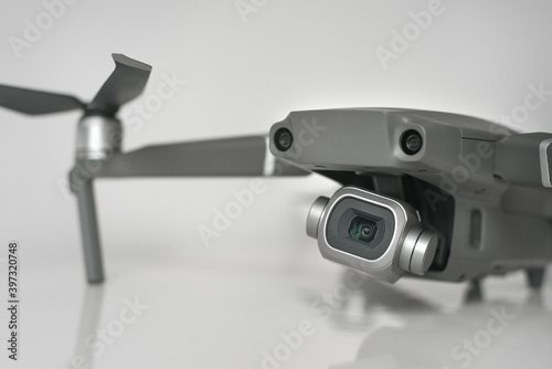 Close up of new dark grey drone with high resolution digital camera and sensors isolated on gray background