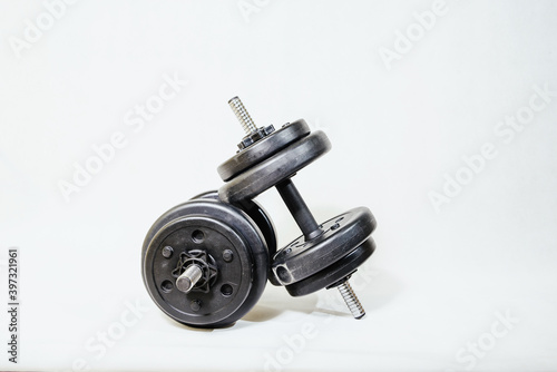 Weights on a white background. The concept of sports, exercises in the gym.