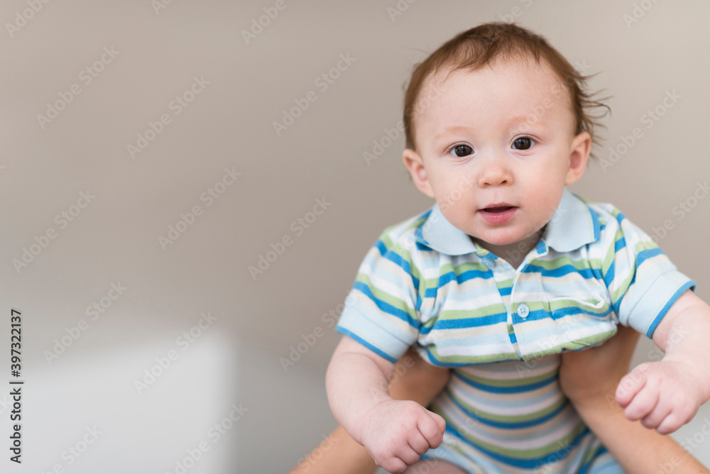 Father lifting Caucasian baby Father lifting Caucasian baby