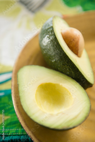 Close up of halved avocado in bowl photo