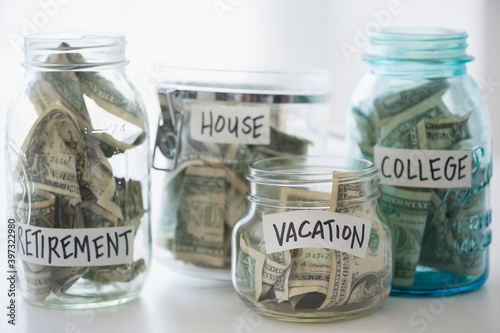 Close up of savings jars with money