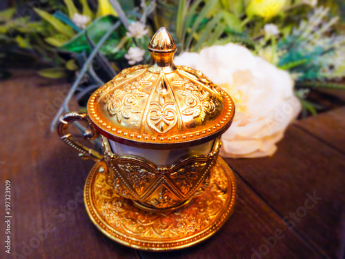 Traditional coffee cup.Gold Turkish coffee cup                           
