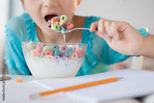Girl eating bowl of cereal