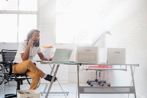Black businessman working in new office