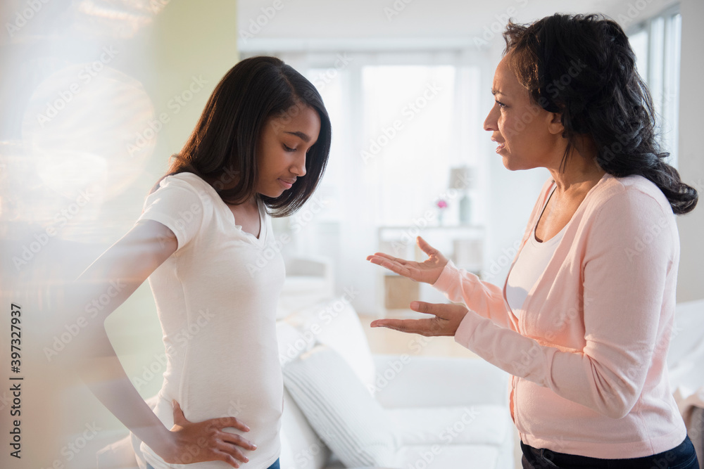 Mother scolding frustrated daughter Mother scolding frustrated daughter