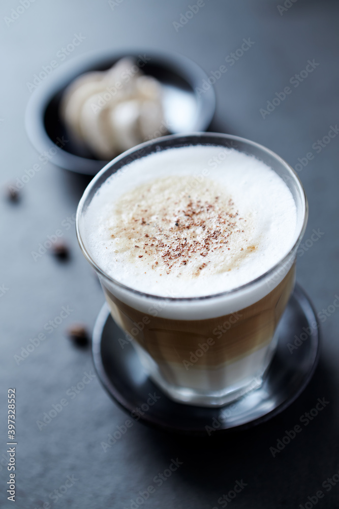 Coffee with milk on dark stone background. Close up. Coffee with milk on dark stone background. Close up.