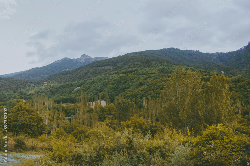 Yellow mountains and cloudy sky.