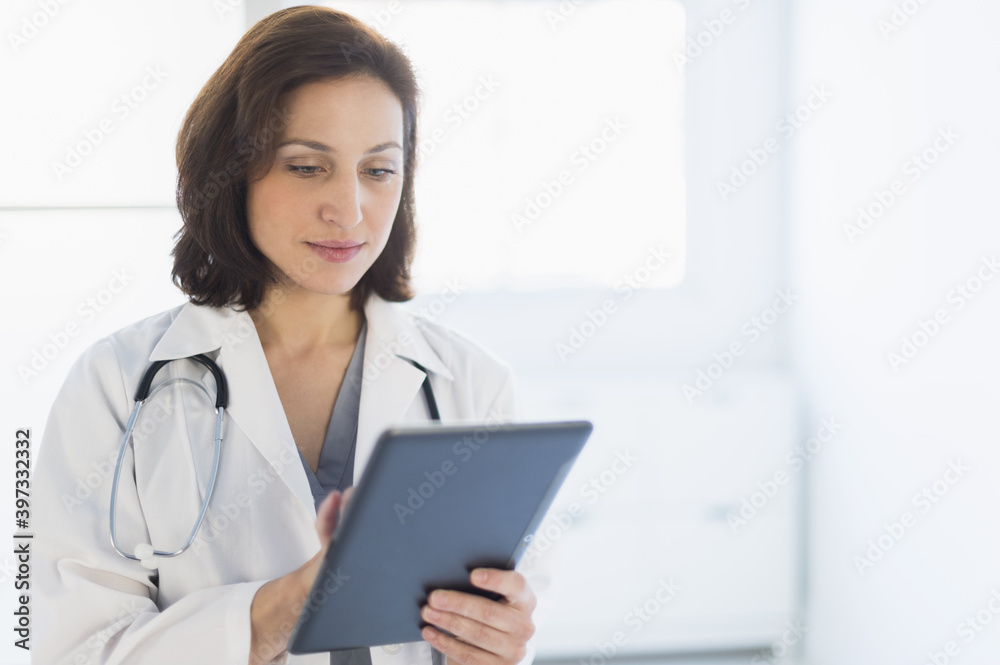 Female doctor using digital tablet Female doctor using digital tablet