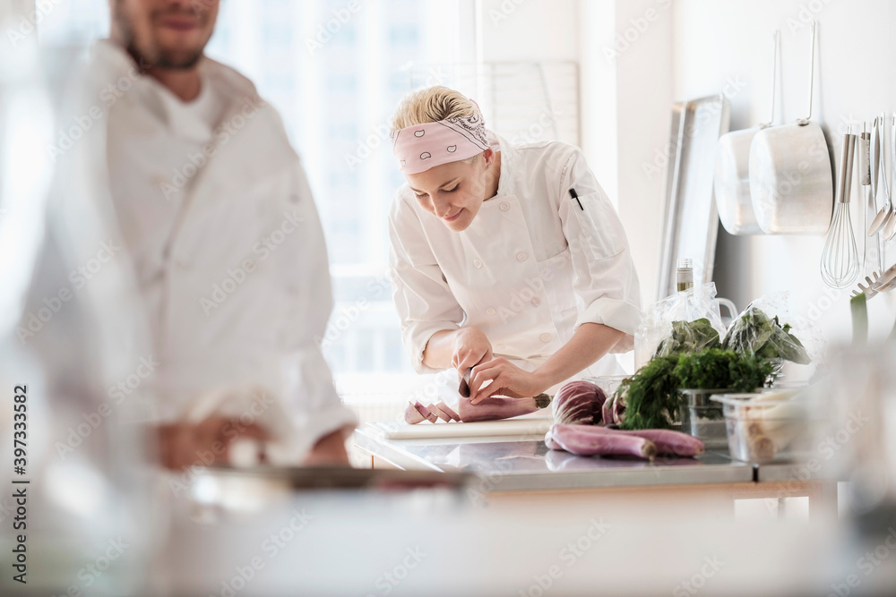 Chefs working in kitchen Chefs working in kitchen