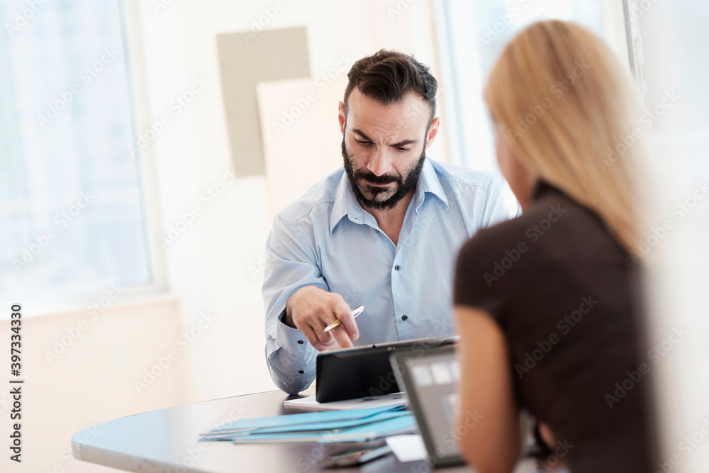 Man and woman working in office Man and woman working in office