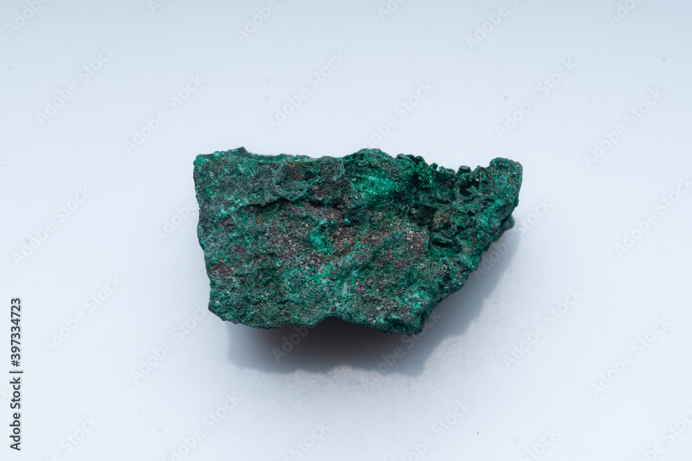 Malachite green ore on a white background. Natural green malachite