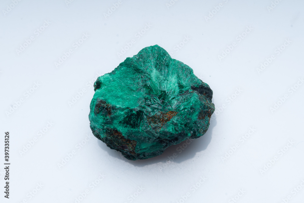 Malachite green ore on a white background. Natural green malachite Malachite green ore on a white background. Natural green malachite