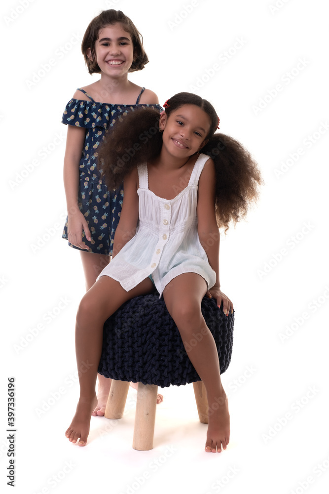 Two friendly small girls, friends or sisters - Isolated on white Two friendly small girls, friends or sisters - Isolated on white
