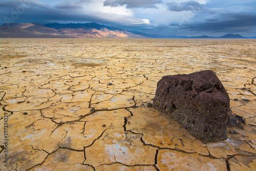 Stormy clouds over cracked earth