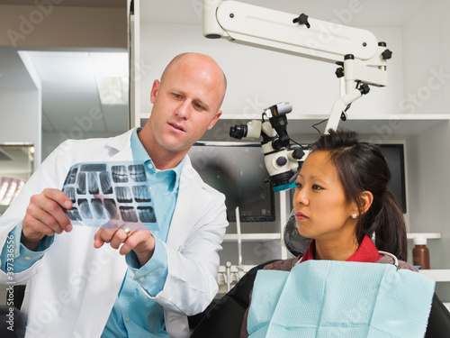 Dentist holding patient's x-ray photo