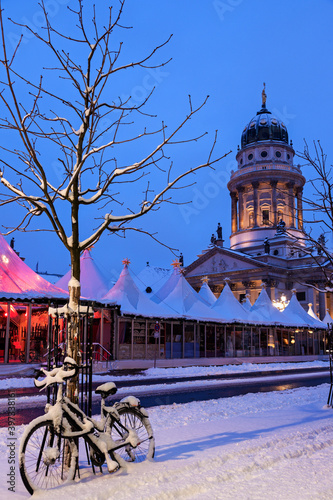 Gendarmenmarkt, Snowy bicycle parked against bare tree photo