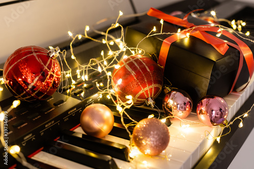 Wall Mural Festive decor on piano keys indoors, closeup. Christmas music