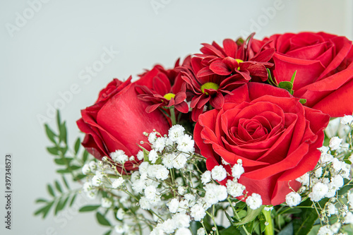 bouquet of flowers. red roses and red daisies