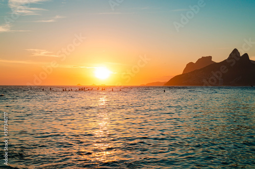 Sunset in rio de janeiro with gavea stone and the two brothers  hill in the background.