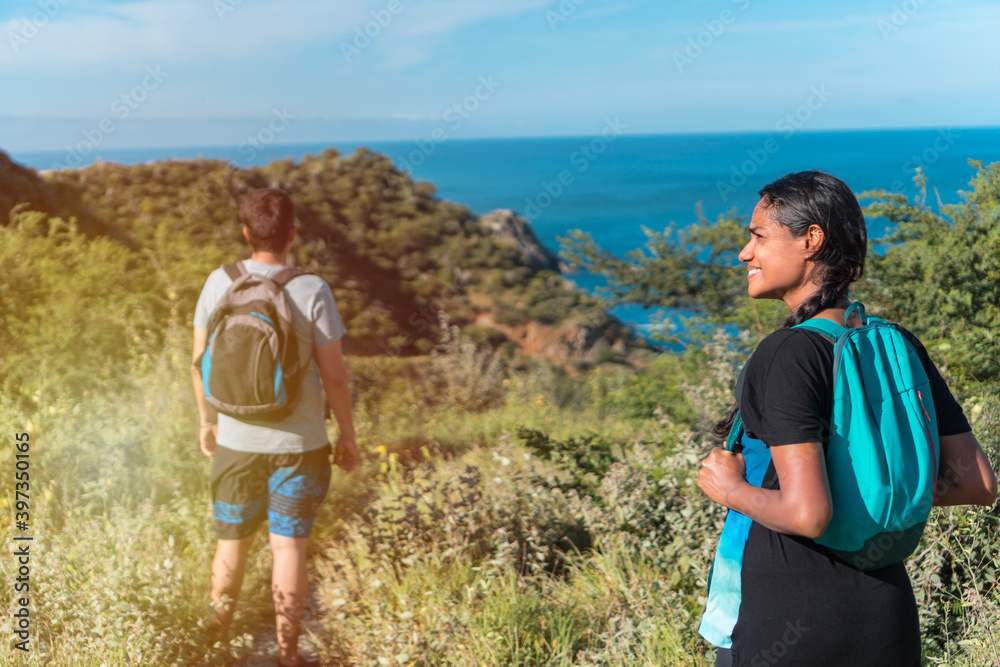 Man And Woman Hiking On A Sunny Day