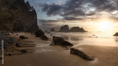 Ecola State Park, Cannon Beach, Oregon, United States. Beautiful Panoramic View of the Sandy and Rocky Beach on Pacific Ocean Coast. Dramatic Sunset Sky.