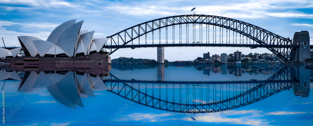 Naklejka premium Sydney Harbour Bridge at night NSW Australia reflection in the harbour waters