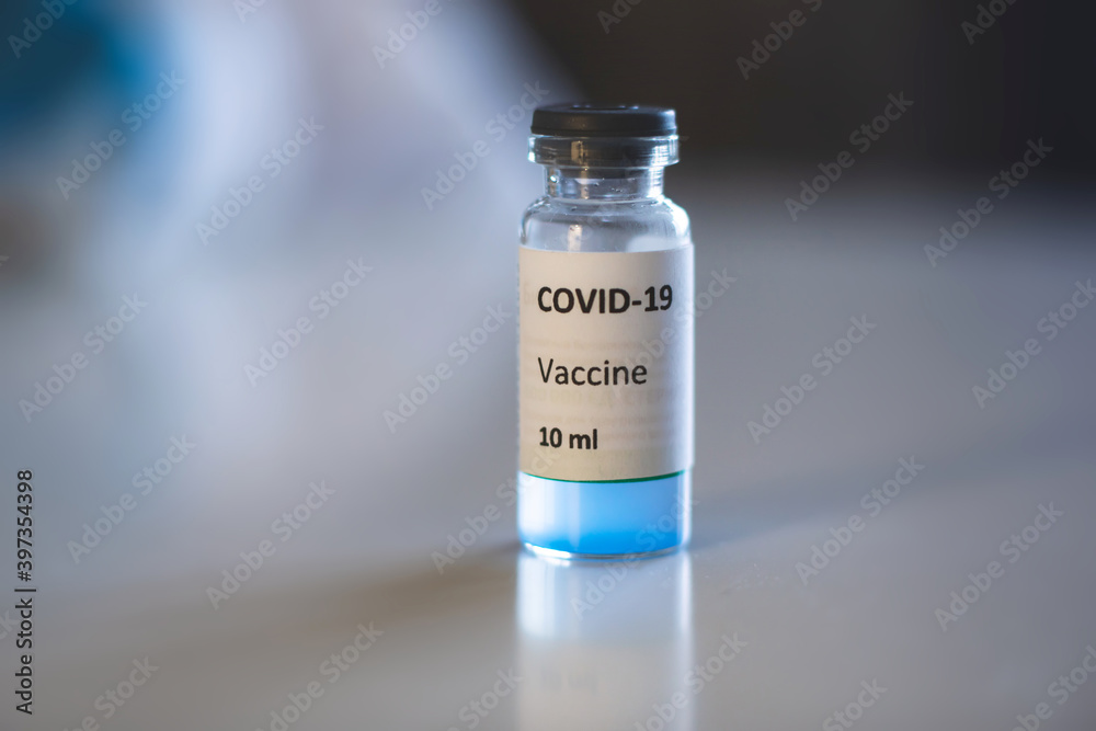 Concept of Covid 19 vaccine vaccinating, development and creation, doctor or scientist in laboratory holding a single dose of 2019-ncov vaccine, a syringe and ampule with SARS-CoV-2 vaccination Concept of Covid 19 vaccine vaccinating, development and creation, doctor or scientist in laboratory holding a single dose of 2019-ncov vaccine, a syringe and ampule with SARS-CoV-2 vaccination