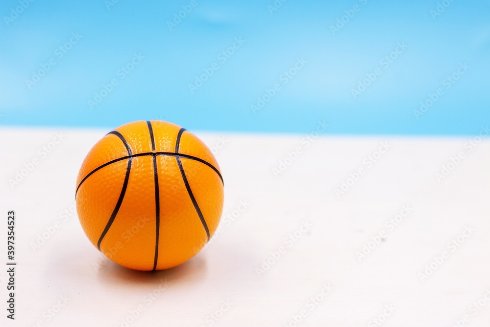 Basketball on blue sky background
