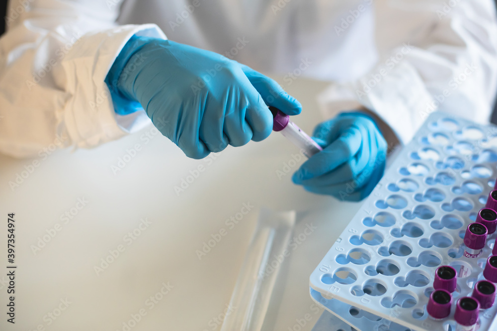 Process of coronavirus testing examination by nurse medic in laboratory lab, COVID-19 swab collection kit, test tube for taking OP NP patient specimen sample, patient receiving a corona test Process of coronavirus testing examination by nurse medic in laboratory lab, COVID-19 swab collection kit, test tube for taking OP NP patient specimen sample, patient receiving a corona test