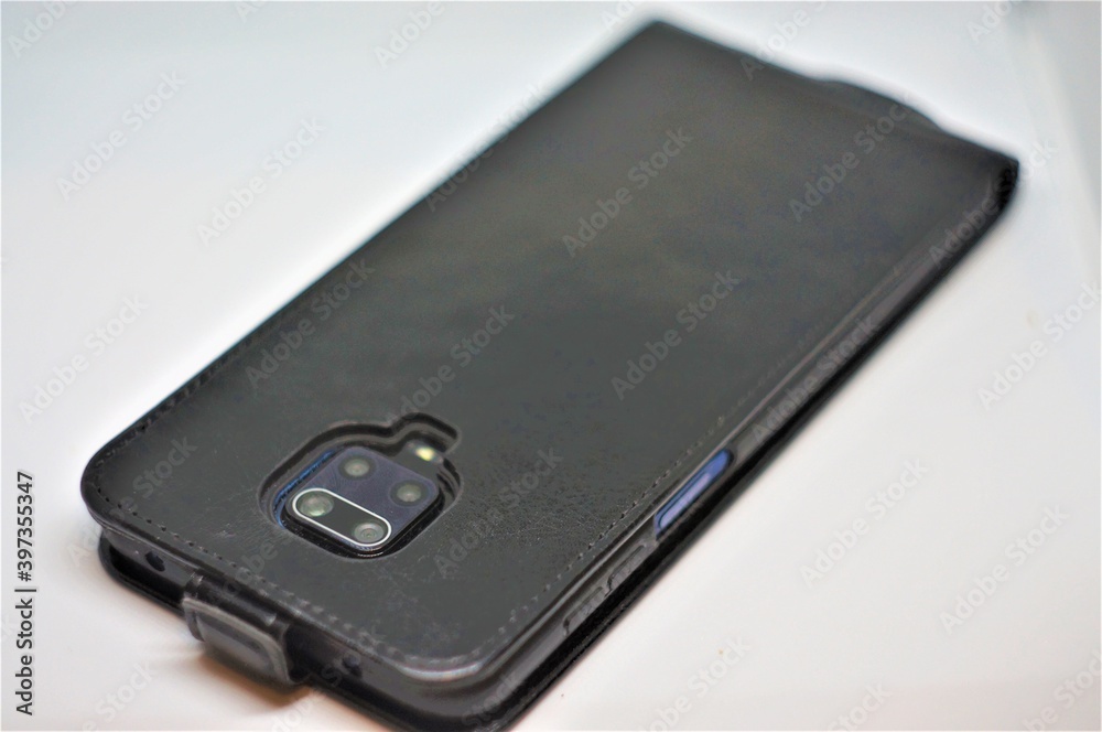 The smartphone in the case is camera up. The smartphone in the case is camera up.