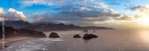 Cannon Beach, Oregon, United States. Beautiful Aerial Panoramic View of the Rocky Pacific Ocean Coast. Dramatic Colorful Sunset Sky.