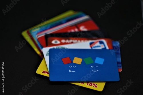 Plastic cards on a dark background. Discount cards.