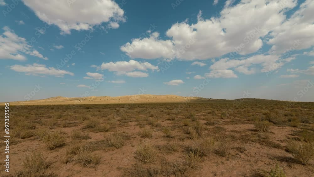 Time lapse tracking shot of prehistoric impact crater in the Southwest desert Time lapse tracking shot of prehistoric impact crater in the Southwest desert