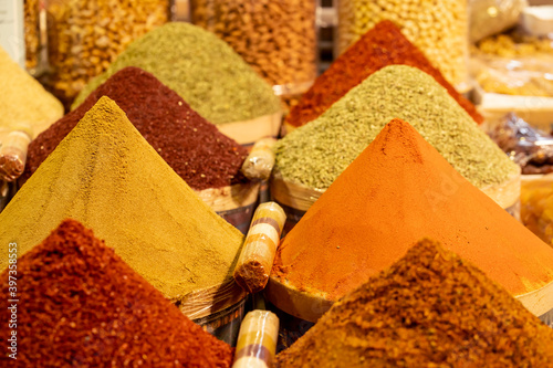 Fototapeta Naklejka Na Ścianę i Meble -  A variety of spices such as curry, turmeric, pepper, saffron, sesame and many more at the Arabic Bazaar in the Muslim country.