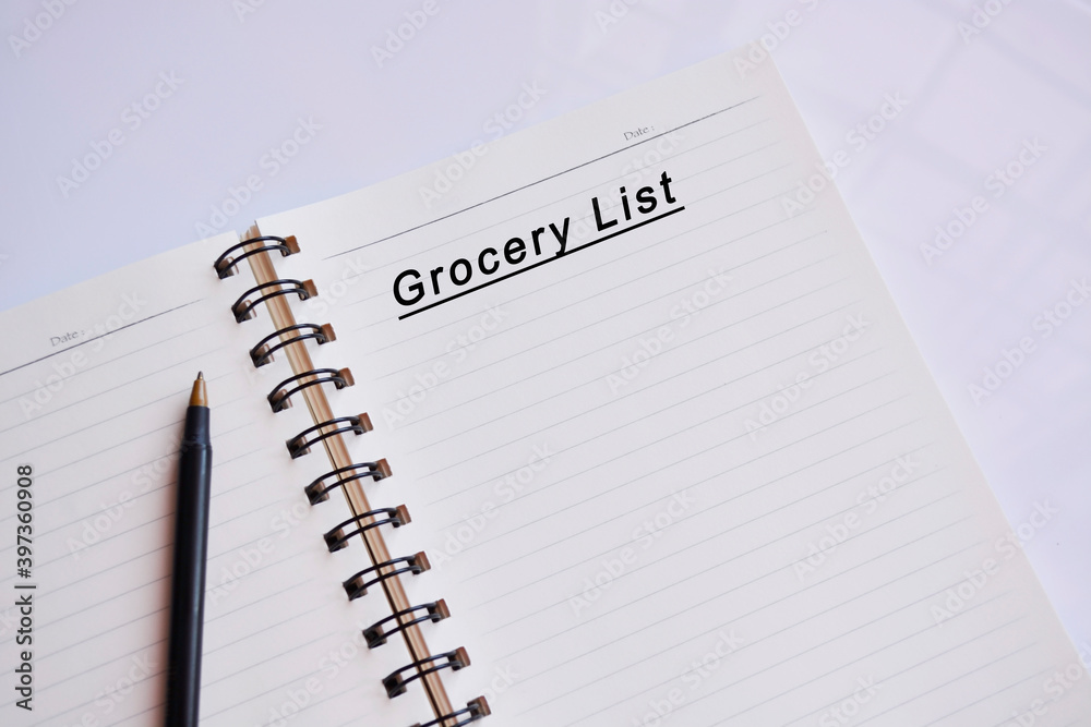 Grocery list text on a notepad with reflection of window glass Grocery list text on a notepad with reflection of window glass