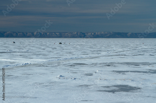 Fishermen on a frozen lake