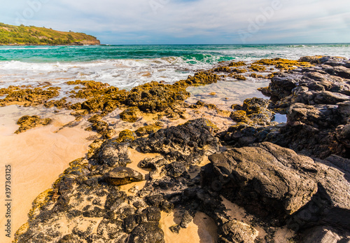 Exposed Coral and Lava Rocks  at Kahili Beach, Kilauea, Kauai, Hawaii, USA photo