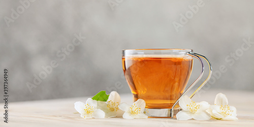 Tea with jasmine in a glass cup. Ceremony concept.