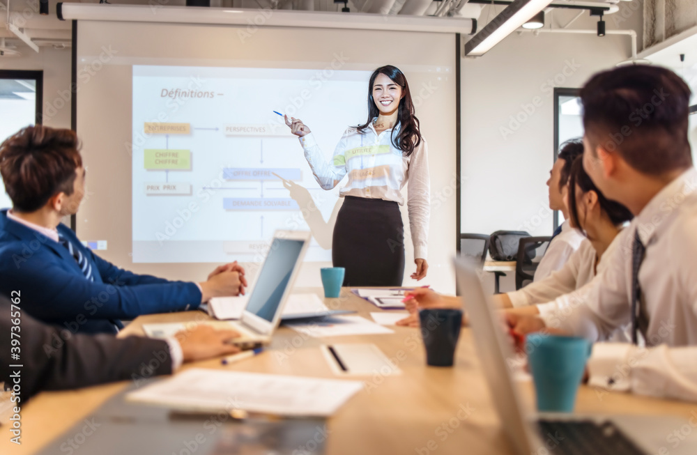 Business woman making presentation in conference room Business woman making presentation in conference room