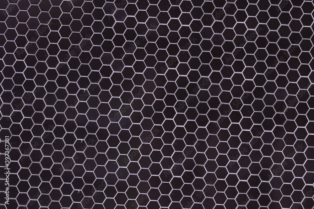 A simple white texture pattern of hexagons as a background A simple white texture pattern of hexagons as a background