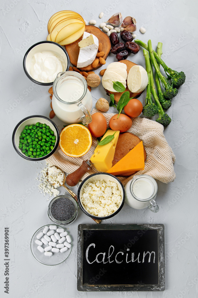 Healthy diary and non-diary products rich in calcium on grey background Healthy diary and non-diary products rich in calcium on grey background