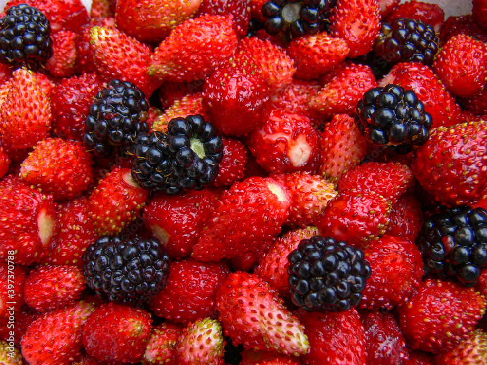Lots of autumn berries: strawberry and blackberry