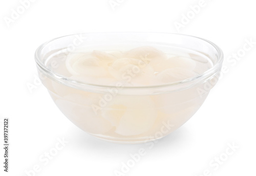 Longan syrup in glass on white background.