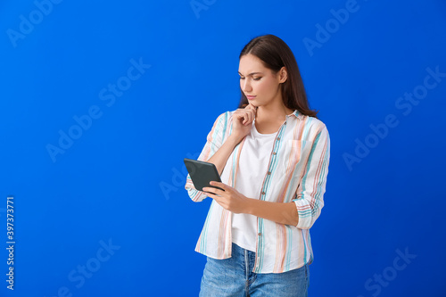 Thoughtful young woman with...