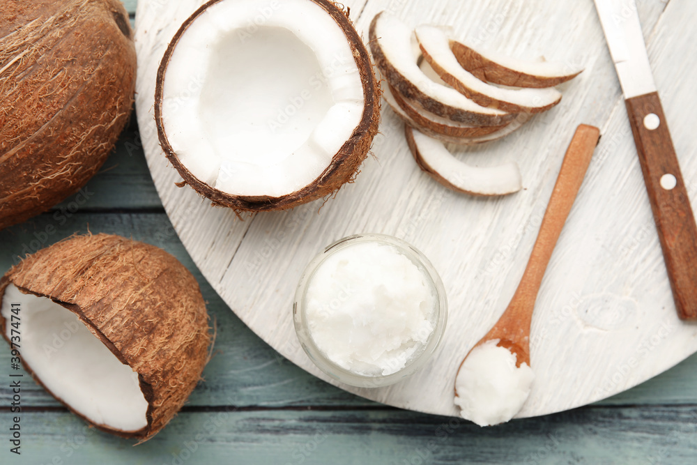 Composition with coconut oil on wooden background Composition with coconut oil on wooden background
