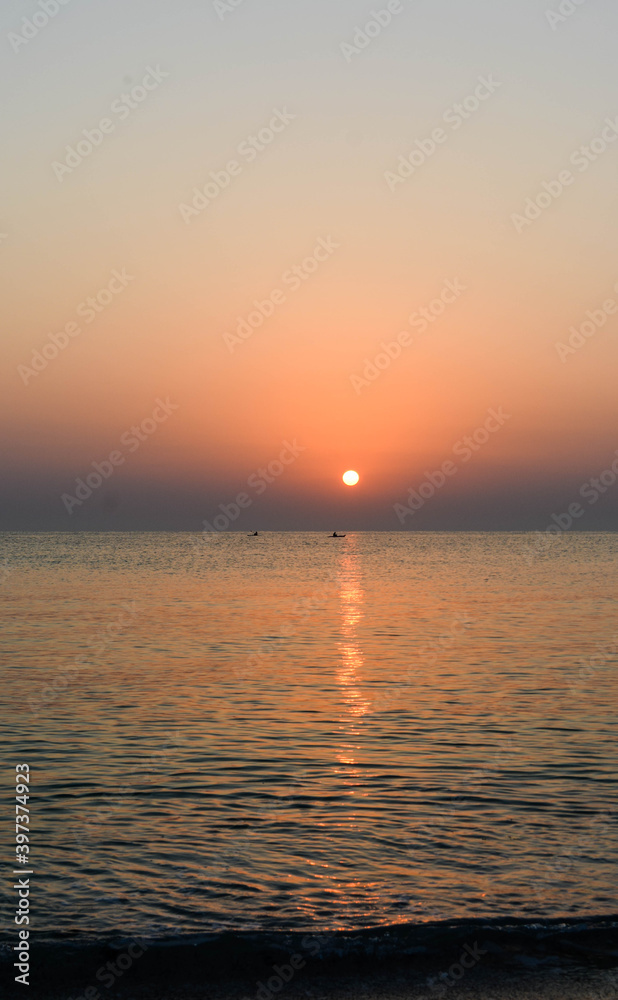 Naklejka premium sun, sea and boat view from the beach 8