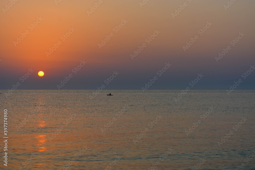 sun, sea and boat view from the beach 2