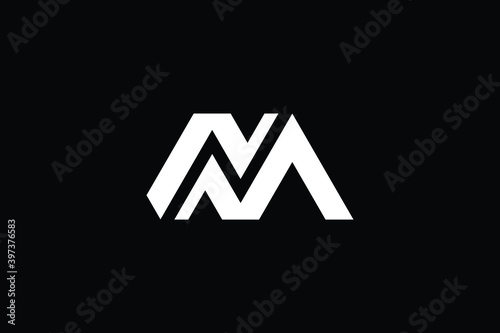 NM logo letter design on luxury background. MN logo monogram initials letter concept. NM icon logo design. MN elegant and Professional letter icon design on black background. M N NM MN