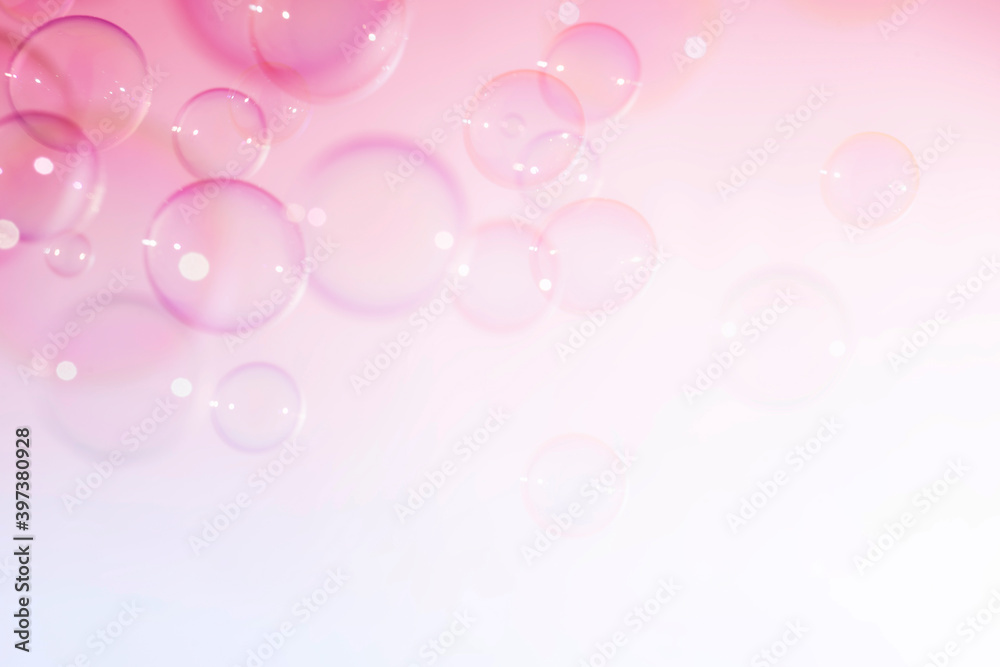 Pink bubbles floating on white background.
