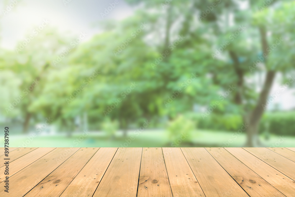 Empty wooden board empty table in front of blurred background. Perspective brown wood over wind nature background - can be used mockup for display or montage your products. copy space. Empty wooden board empty table in front of blurred background. Perspective brown wood over wind nature background - can be used mockup for display or montage your products. copy space.